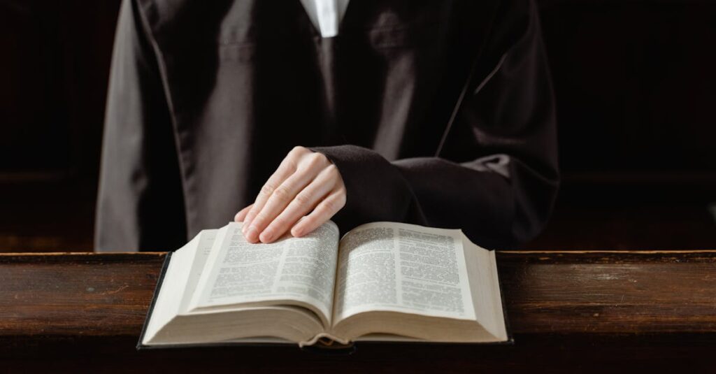 A person in religious attire reading an open Bible, highlighting the connection to spirituality.
