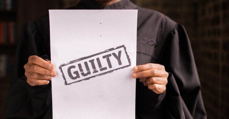A judge in a courtroom holding a paper with a guilty verdict, symbolizing law and justice.