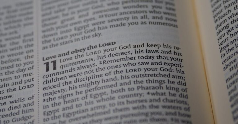 A detailed close-up of a Bible page focusing on a passage about love and obedience to God.